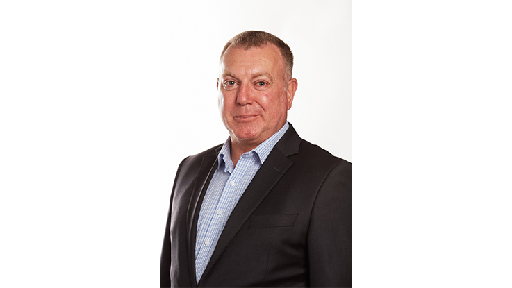 man in a suit looking directly at camera