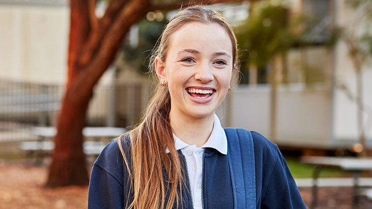 a high school student smiling