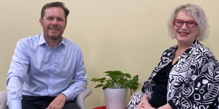 Doug Taylor CEO and Karen Russell sitting looking at camera
